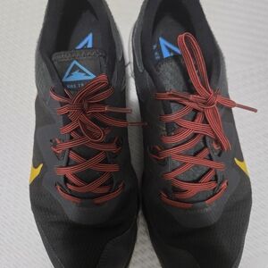 Nike Black Sneakers with Red Laces and Yellow Swoosh